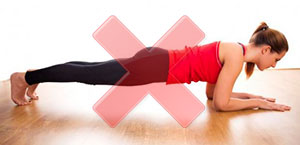 болит спина от упражнения планка